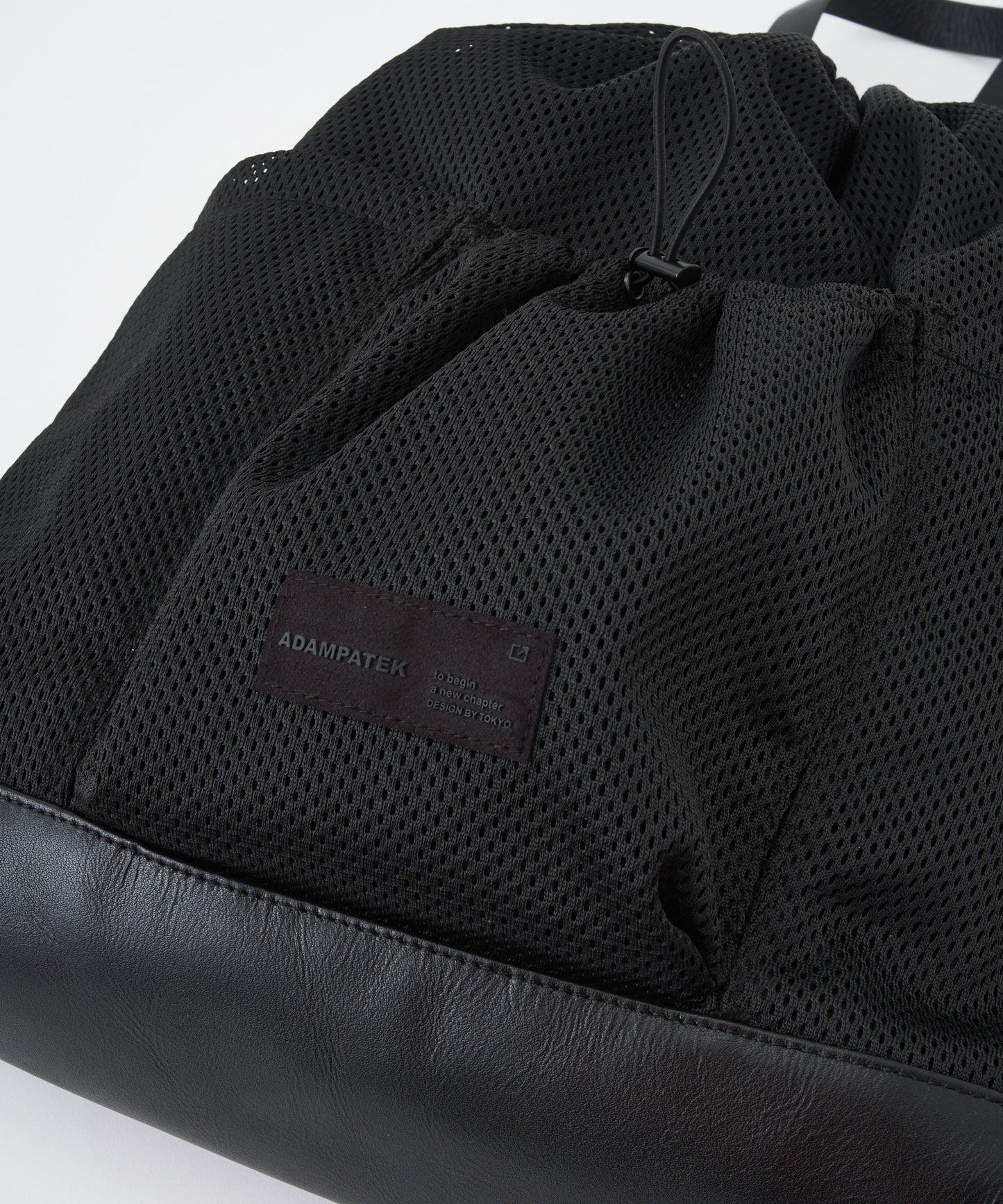 〈予約〉Leather trimmed  mesh drawstring bag